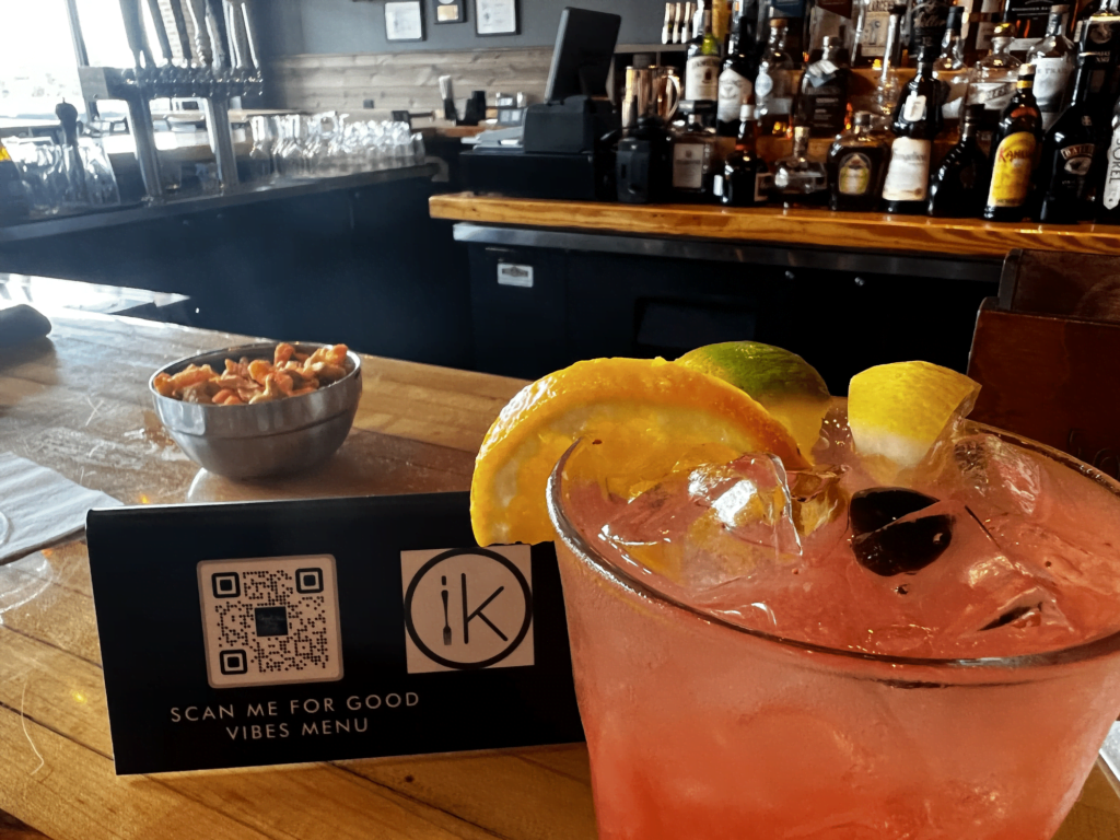 Innovo QR code for restaurant menu loated on bar counter